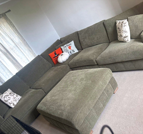 Corner sofa with footstool
